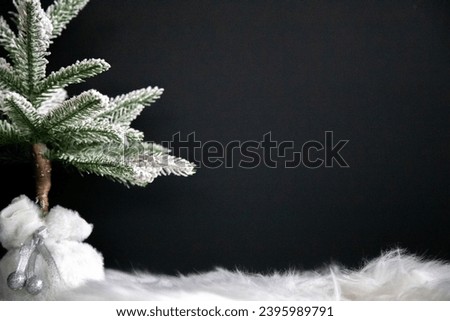 Snowy tree with silver bells for holiday message or design
