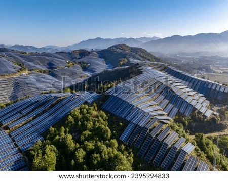 Aerial photography of solar photovoltaic panels on the mountain