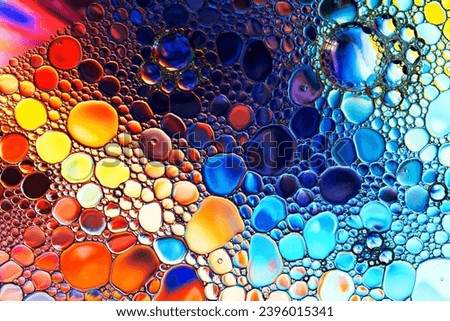 Abstract background with colorful gradient colors. Oil drops in water abstract psychedelic pattern image. Royalty-Free Stock Photo #2396015341