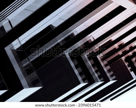 A grayscale shot of an abstract modern geometric building with sharp-edged balconies Royalty-Free Stock Photo #2396015471