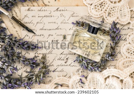 perfume, lavender flowers, vintage ink pen and old love letters. retro style toned picture