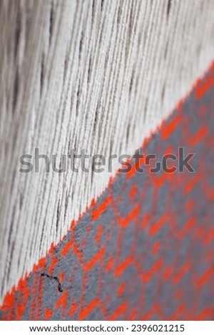 A close-up image of the warp and weft of a traditional Persian rug being woven in a workshop in Kashan. The image is a testament to the skill and artistry of the weavers, and it captures the beauty... Royalty-Free Stock Photo #2396021215