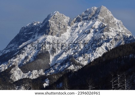 Impressive winter shot of Bosruck, a mountain in the Austrian Alps. The mountain range near Windischgarsten impresses in this photo with a very lively play of light and shadow.