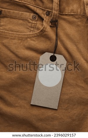 Brown corduroy pants with tag close up
