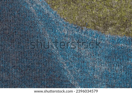 Abstract composition with a close up of a crop protection net. Colorful background.
