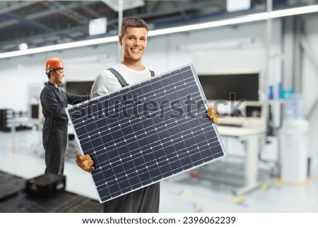 Solar panel manufacturing technology, workers at production line Royalty-Free Stock Photo #2396062239