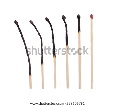 Six lucifers, each used a bit longer, isolated Royalty-Free Stock Photo #239606791