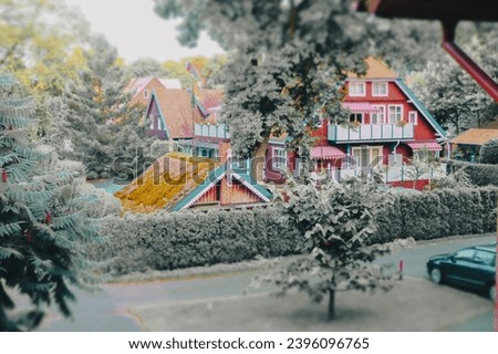 Nida town in Neringa, Lithuania, Europe, local traditional architecture, red wooden house in summer time Royalty-Free Stock Photo #2396096765