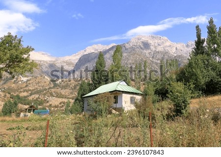 the mountain landscape close to Arslanbob, Kyrgyzstan, Central Asia Royalty-Free Stock Photo #2396107843