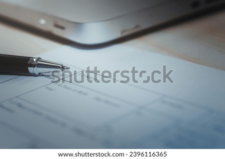 Pen on paper documents, business application.