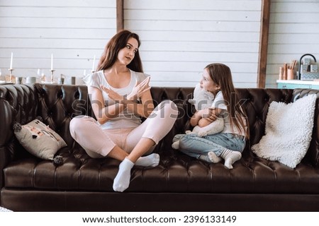 Mother saying no and setting limits. Woman imposing boundaries in non-permissive parenting style upbringing. Female talking wih kid about conflict, quarrel at home Royalty-Free Stock Photo #2396133149