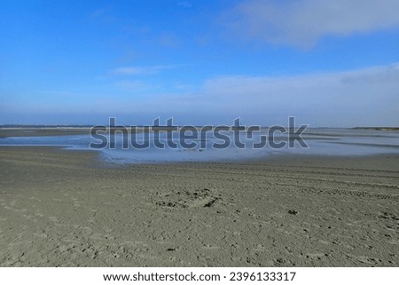 Beach sailors are prepared on the wide beach of the Dutch North Sea island Schiermonnikoog.