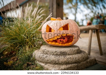 Jack O Lantern carved pumpin in autumn, kids decoration for Halloween