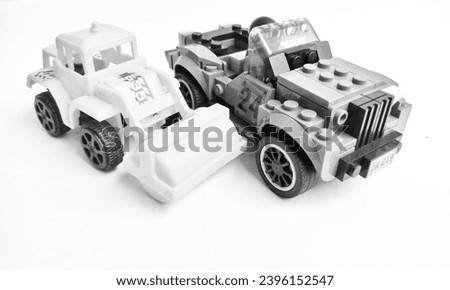 black and white photo of mini toy car
