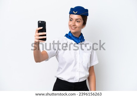Airplane stewardess caucasian woman isolated on white background making a selfie