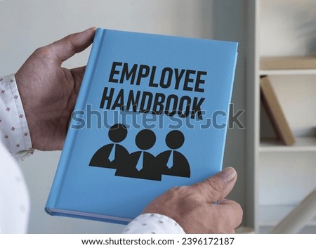 Employee handbook and HR compliance is shown on the photo using a text Royalty-Free Stock Photo #2396172187