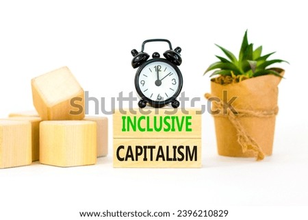 Inclusive capitalism symbol. Concept words Inclusive capitalism on beautiful wooden blocks. Beautiful white table white background. Black alarm clock. Business inclusive capitalism concept. Copy space