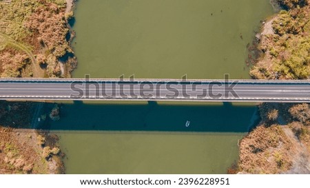 No traffic on the road bridge over Olt river in Romania | drone view