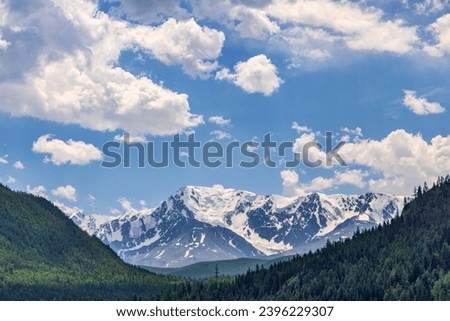 landscape with Altai mountains in snow and green forest Royalty-Free Stock Photo #2396229307