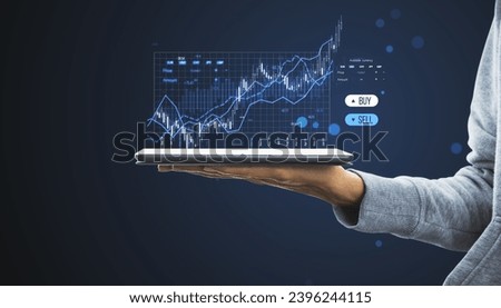 Close up of female hand holding smartphone with creative candlestick trading graph on blurry background. Selling and buying stocks, market, investment and financial growth concept. Toned image