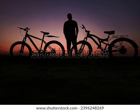Standing moment in twilight with bicycle 