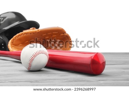 Baseball glove, bat, ball and batting helmet on grey wooden table against white background