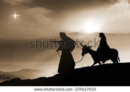 Christmas religious nativity concept: Silhouette pregnant Mary and Joseph with a donkey on Bethlehem background