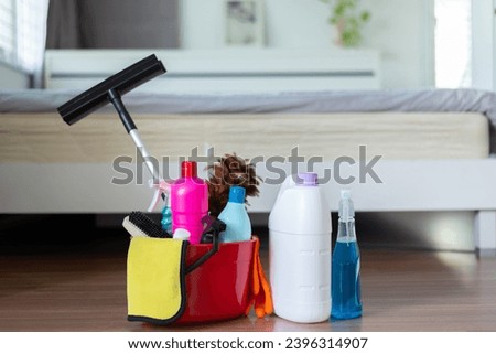 A cleaning products on wooden floor in bedroom,House cleaning concept Royalty-Free Stock Photo #2396314907