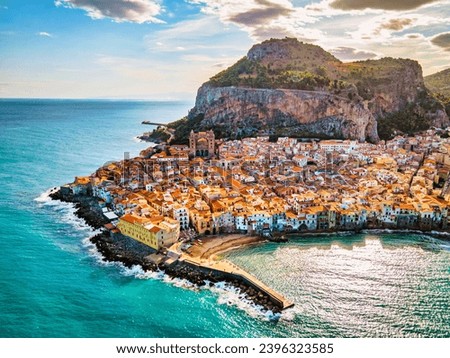 Drone view from above at the old town of Cefalu at sunset, medieval village of Sicily island, Province of Palermo, Italy. Europe. Cathedral of Cefalu Royalty-Free Stock Photo #2396323585