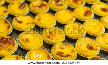 Picture of a sweet dessert made from eggs. By this type of dessert It's called egg tart, which in this picture is the food when it's finished baking.