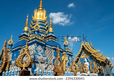 Wat Rong Suea Ten (Blue Temple) Monumental, modern Buddhist temple distinguished by its vivid blue coloring  elaborate carvings. Royalty-Free Stock Photo #2396330041