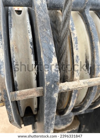 A mobile crane hook Block with slightly Damage sheave Royalty-Free Stock Photo #2396331847