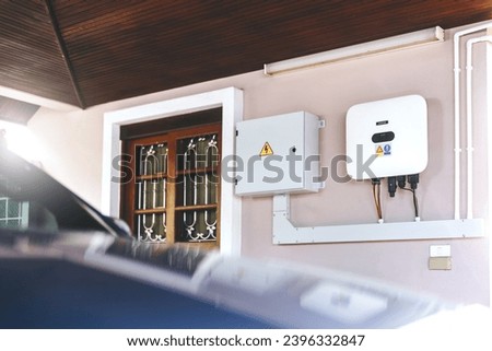 Electrical control cabinet of solar cell PV grid tile Inverter system. Installation for home user. Save electric bill with innovation technology. Royalty-Free Stock Photo #2396332847