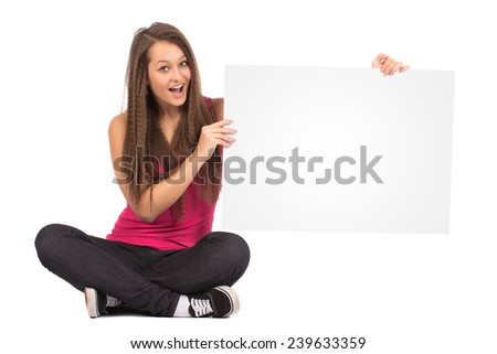 Casual Female In Pink Shirt Sitting And Holding a Blank Billboard Isolated on White Background