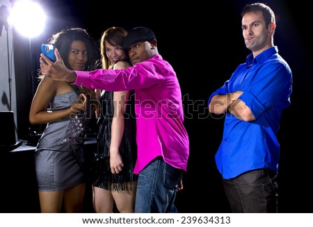 male and women rudely interrupted by a flirting pickup artist at a bar 
