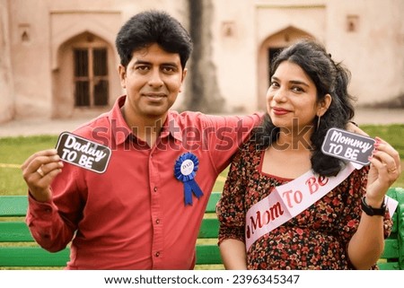 Indian couple posing for Maternity shoot pose for welcoming new born baby in Lodhi Road in Delhi India, Maternity photo shoot done by parents for welcoming their child, Pre Baby Photo Shoot