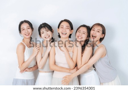 Portrait of group of middle aged Asian women with natural color clothes. Skin care. Cosmetics. Anti-aging. Royalty-Free Stock Photo #2396354301