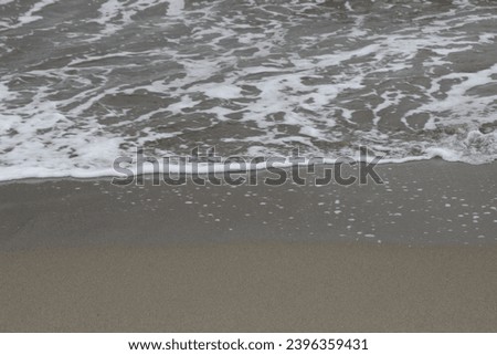 Waves and sands at sea coast