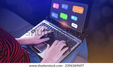 People using touching social media and digital online marketing concepts on laptop with icons such as notifications, messages, comments on the screen.