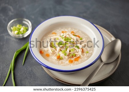 Dakjuk. Korean rice chicken porridge with spring onions Royalty-Free Stock Photo #2396375425