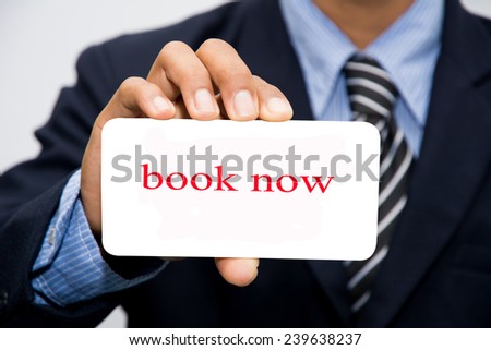 Businessman hand holding book now concept
