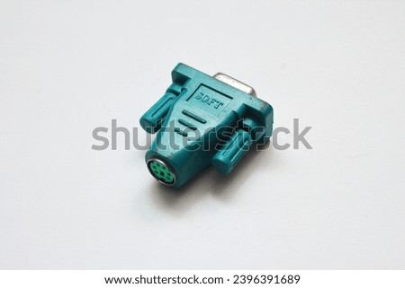 The blue-green serial connector looks similar to the blue VGA connector on a white background.