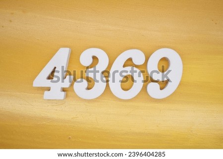The golden yellow painted wood panel for the background, number 4369, is made from white painted wood.