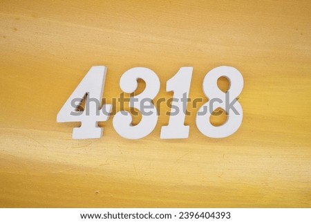 The golden yellow painted wood panel for the background, number 4318, is made from white painted wood.