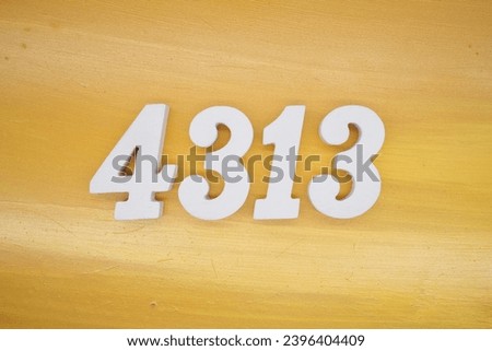 The golden yellow painted wood panel for the background, number 4313, is made from white painted wood.