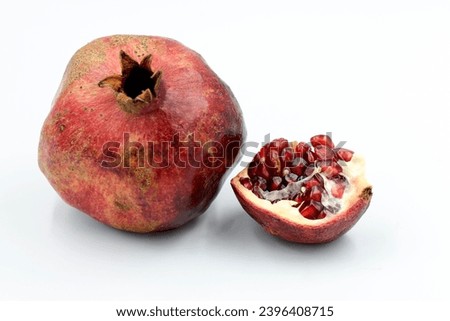 Pomes of pomegranates (Punica granatum) in the autumn Royalty-Free Stock Photo #2396408715