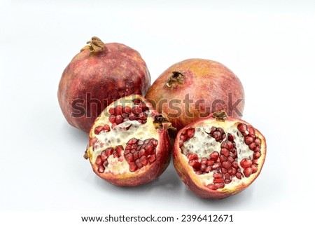 Pomes of pomegranates (Punica granatum) in the autumn Royalty-Free Stock Photo #2396412671