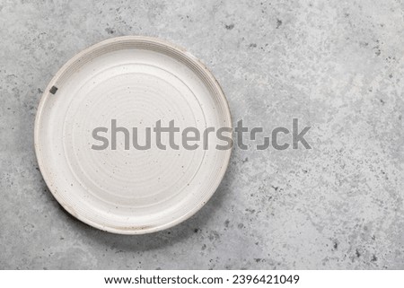 Mockup for a delicious meal. Empty plate on a table. Flat lay with copy space