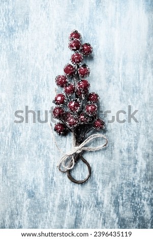 Christmas branch on wooden background. Soft focus. Top view. Close up. Copy space. 
