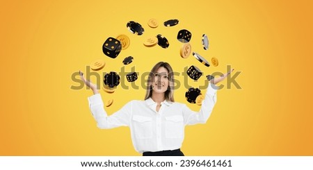 Dreaming and happy businesswoman with open hand palms, falling dollar coins and dice with poker chips on wide format orange background. Concept of jackpot, luck and success